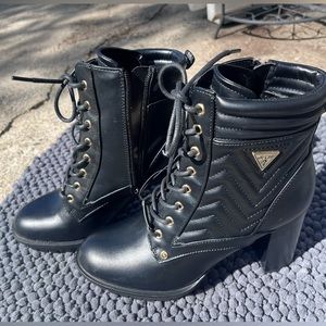 Look tall and dress up in style wearing the GUESS Manners boots.